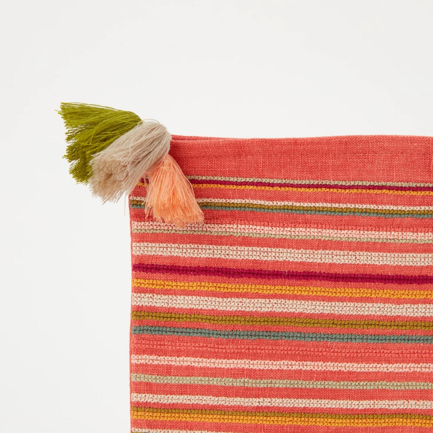 Striped fabric with tassels on a white background