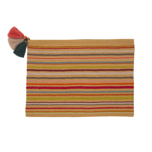 Striped pouch with colorful tassels on a white background